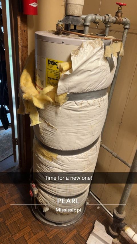 Worn-out water heater wrapped in torn insulation, Pearl